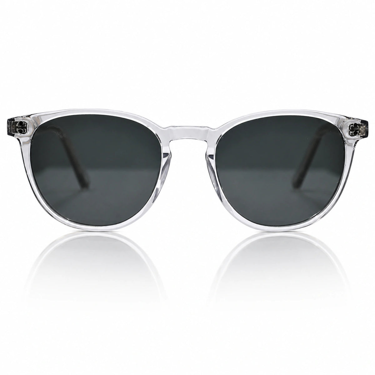 Clear acetate round-frame sunglasses with dark gray lenses, shown from the front on a white background with a soft reflection below.