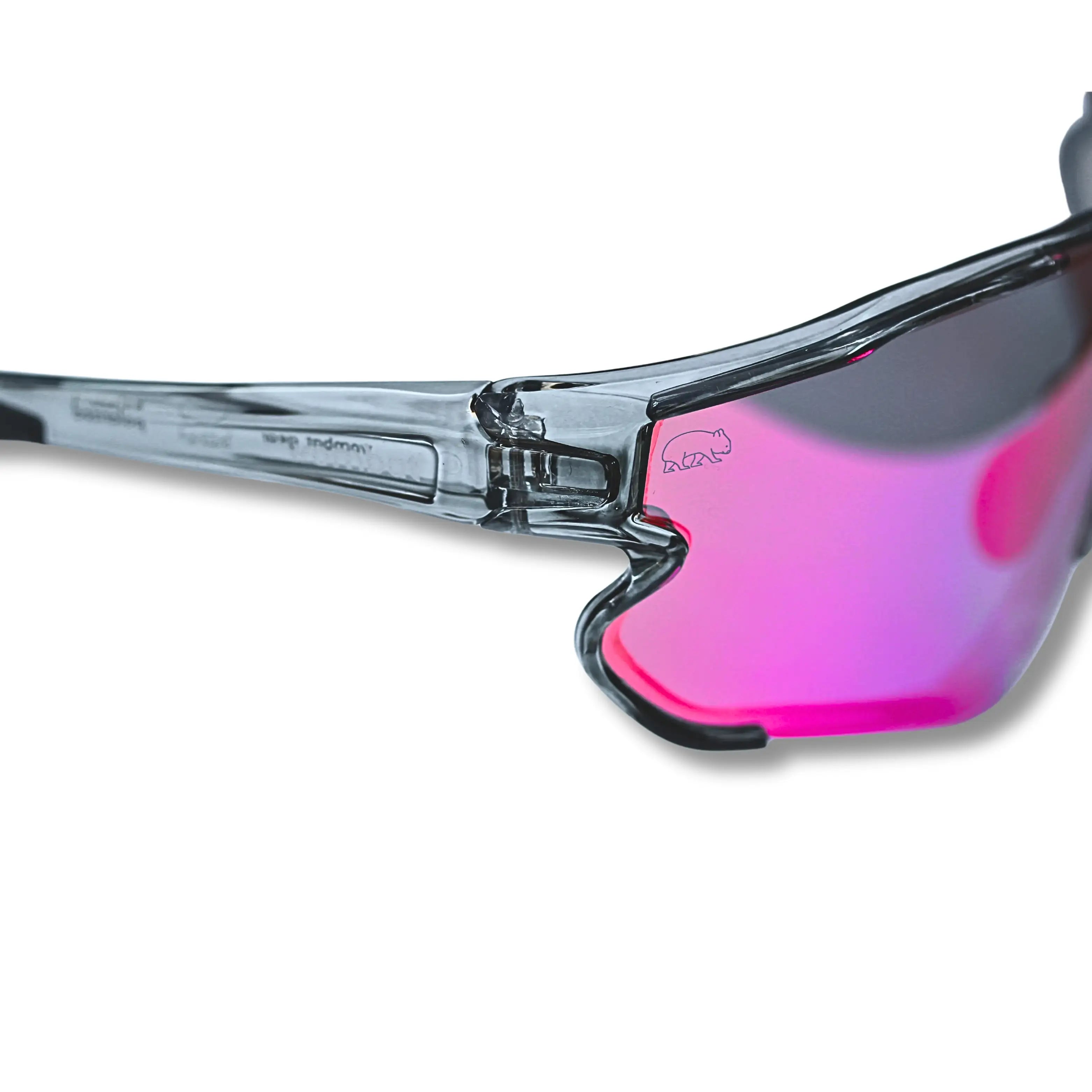 Close-up of sunglasses with pink lenses and clear frame on a white background
