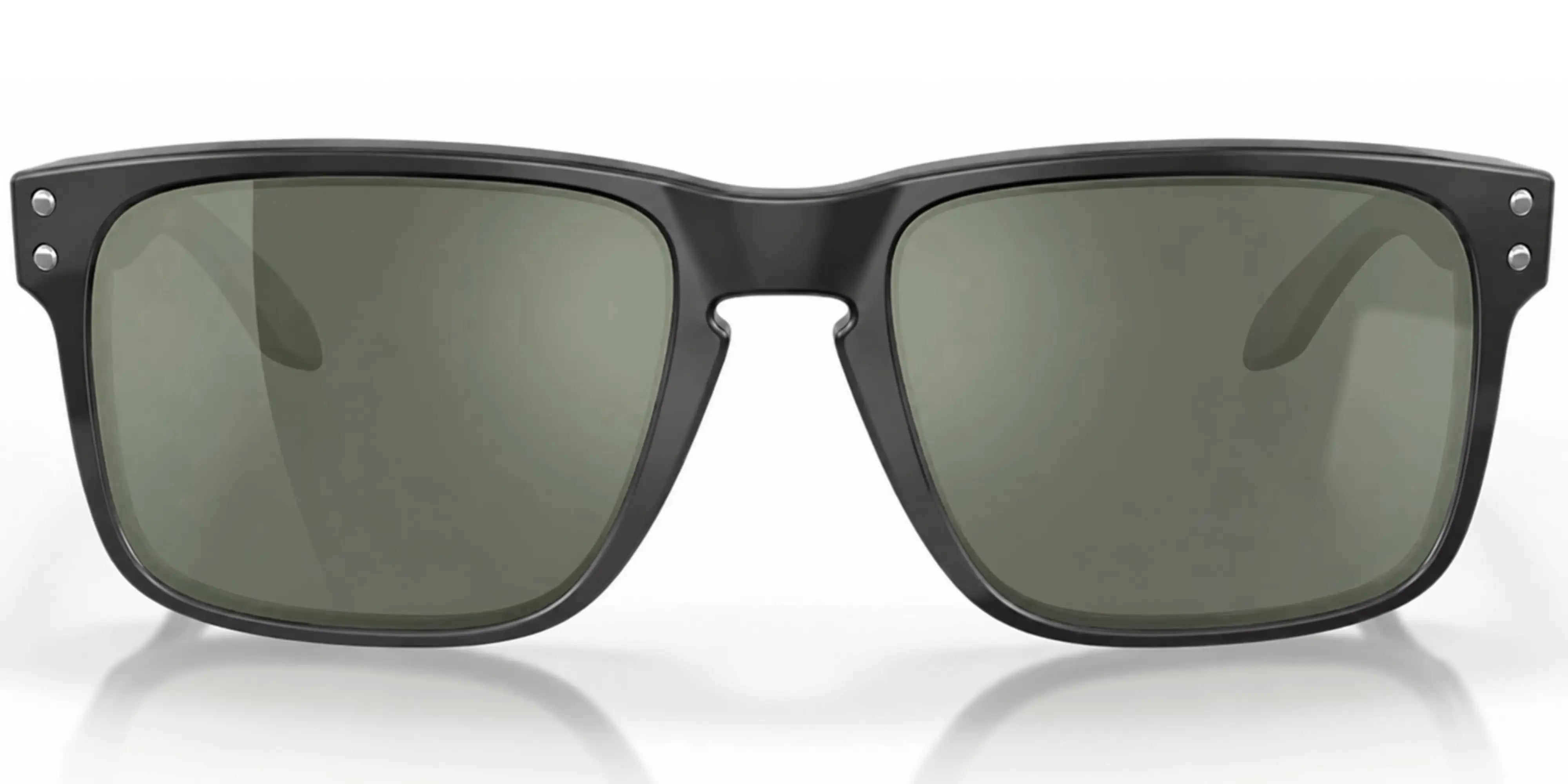 Black Oakley sunglasses with green lenses on a white background