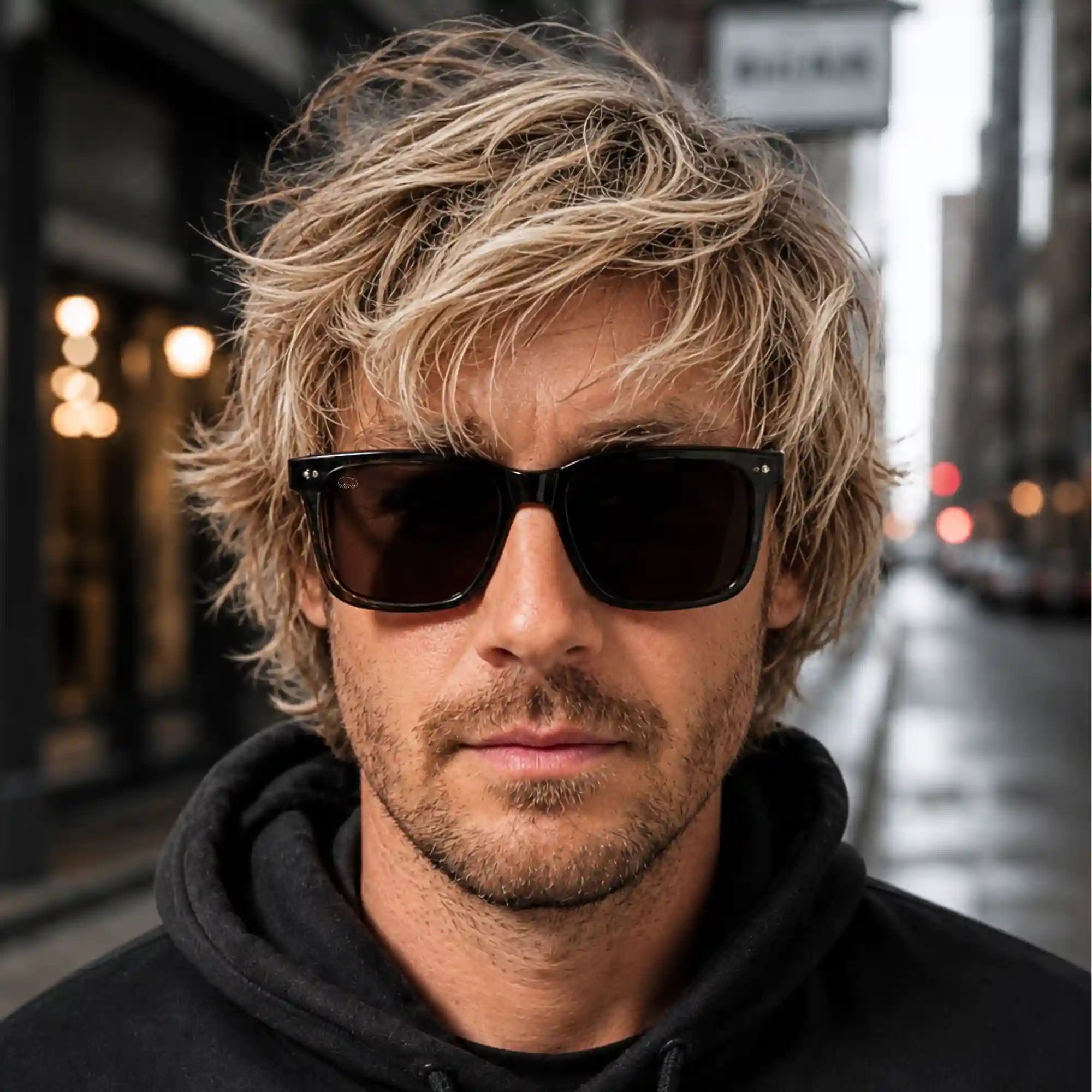Man with Wombat Oslo sunglasses and blonde hair in an urban setting