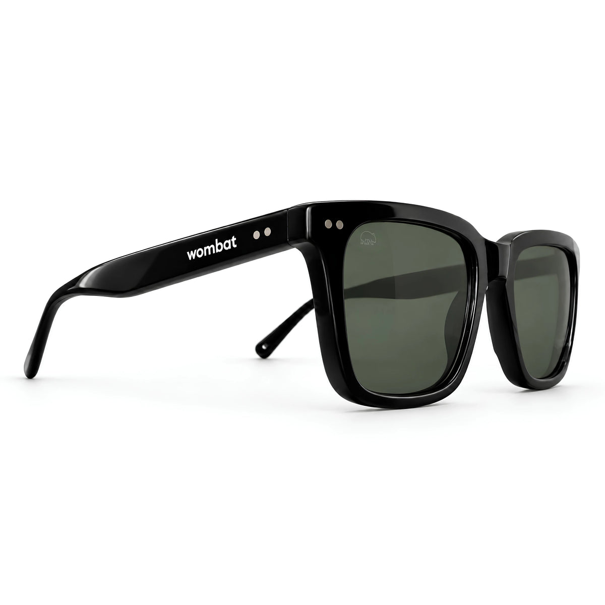 Wombat Oslo premium sunglasses three-quarter angle — satin black bio-acetate frame and grey-green CR39 polarised lenses